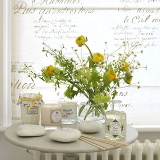 candles and flower on table