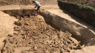 The archaeologists have discovered about 35 skeletons, almost all missing their heads, in a mass grave that dates from about 5000 B.C. at Vráble in western Slovakia.