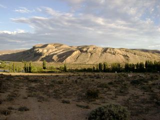 Fossils of a newly identified stubby-armed dinosaur were discovered in the Jurassic Cañadón Asfalto Formation outcrops, shown here in the evening sunlight, in Patagonia, Argentina.