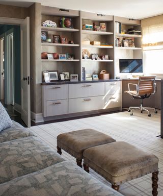 cozy bright home office with neutrals open shelving storage and a large couch