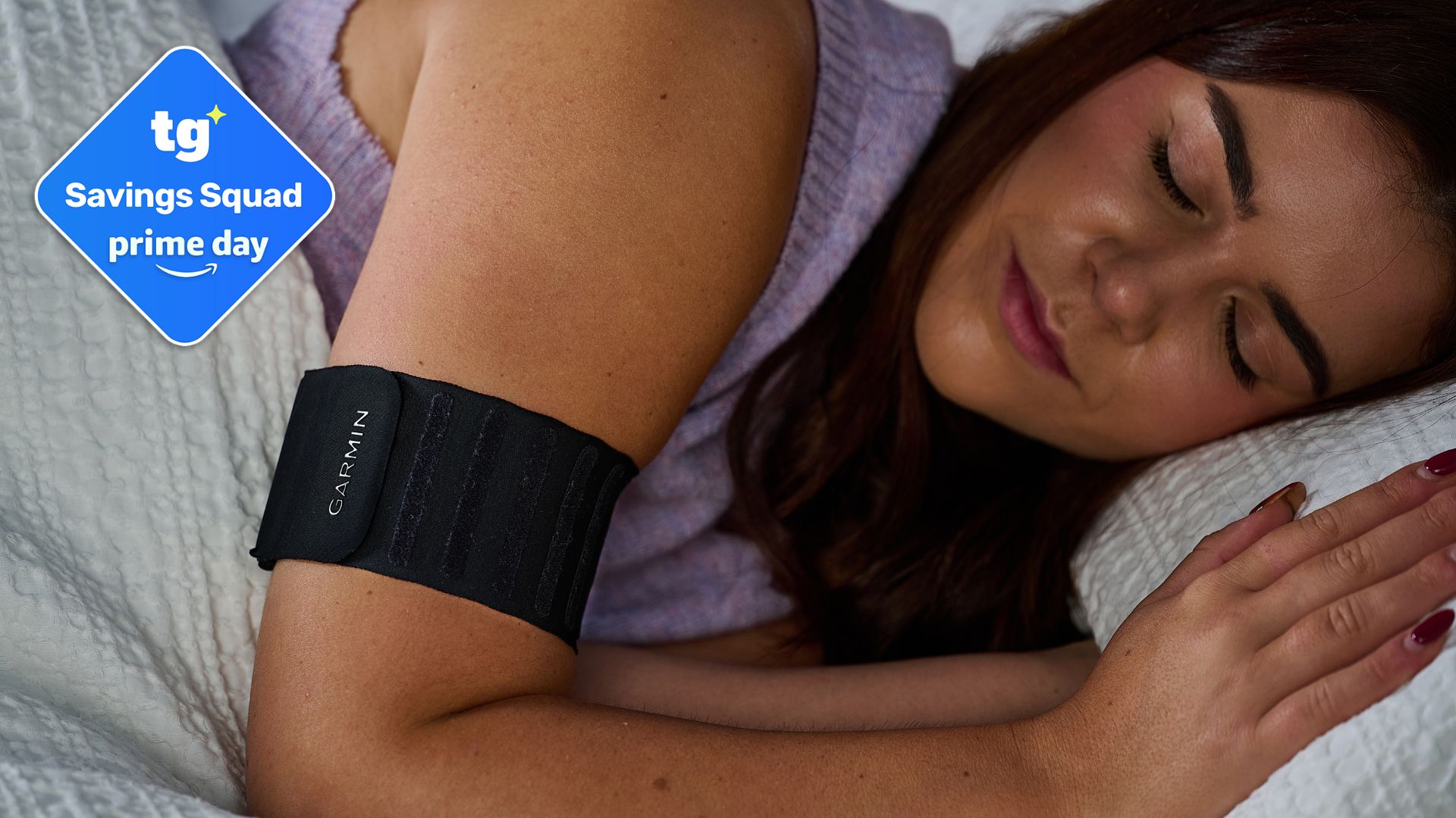 A woman wears a Garmin Index Sleep Monitor. In the top right hand corner, there is a Prime Day deals badge. 