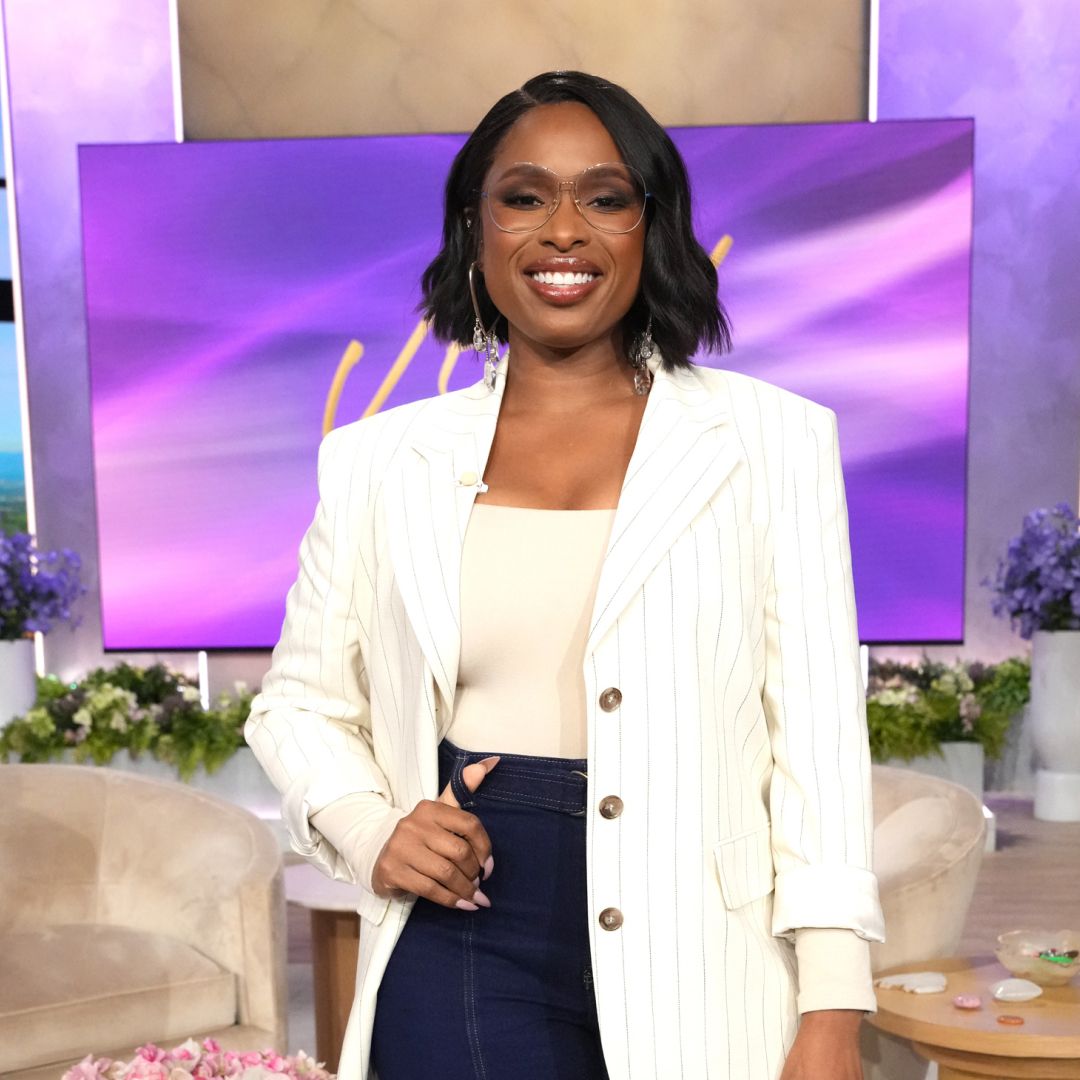 Jennifer Hudson wearing a bob haircut a white striped blazer