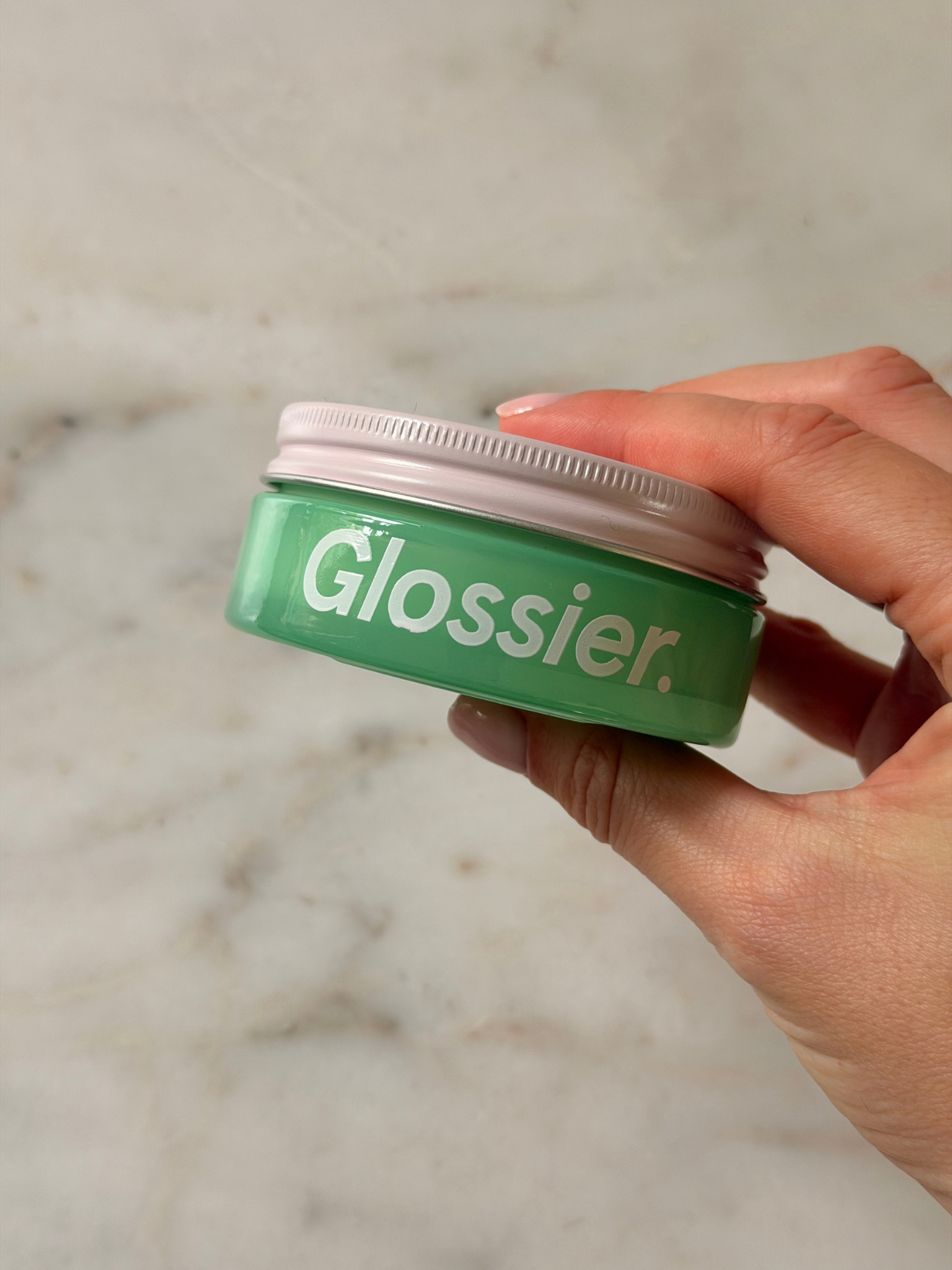 Freelance beauty editor Grace Day holding the Glossier moisturiser