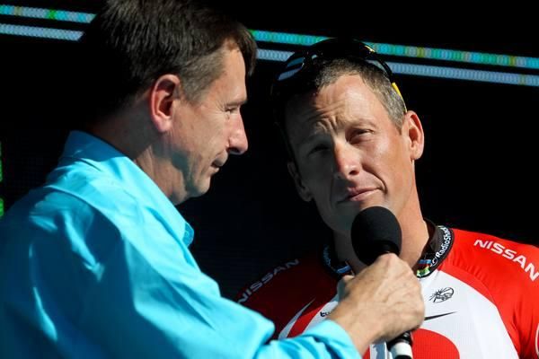 Lance Armstrong speaks with Paul Sherwen.