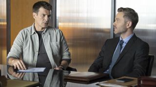 Nathan Fillion and Shawn Ashmore as John and Wesley in an office in The Rookie season 6