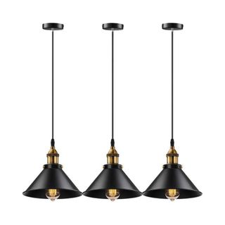 three black pendant lights with brass detail