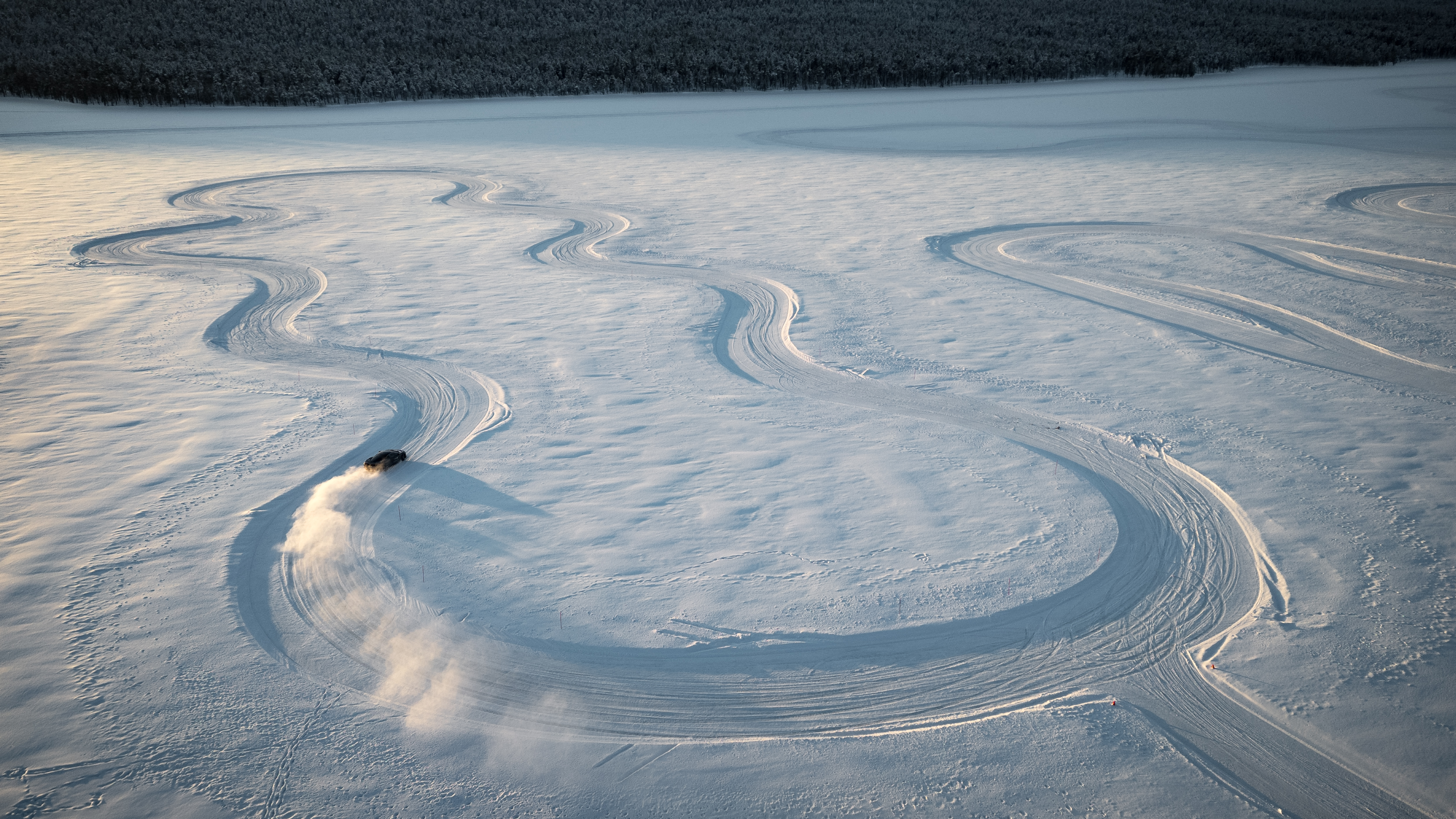 Images of a McLaren Artura going sideways on some ice