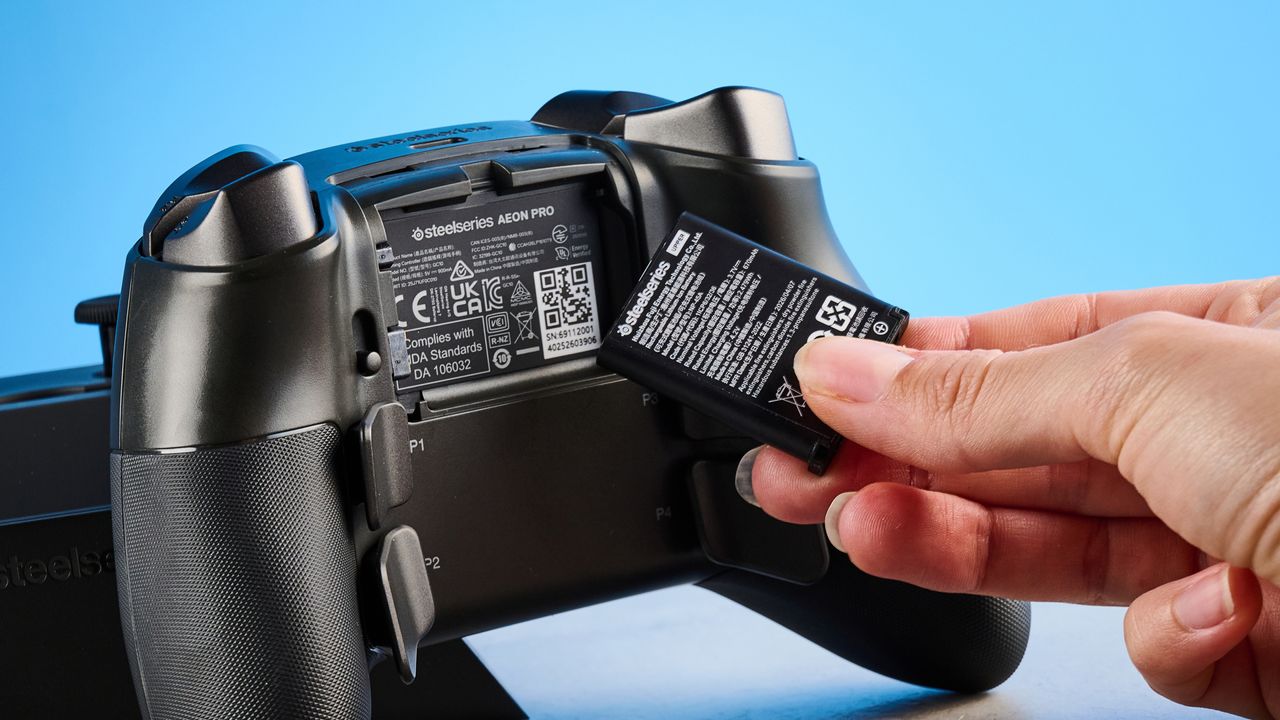 The SteelSeries Aeon Pro on a stone surface against a blue background