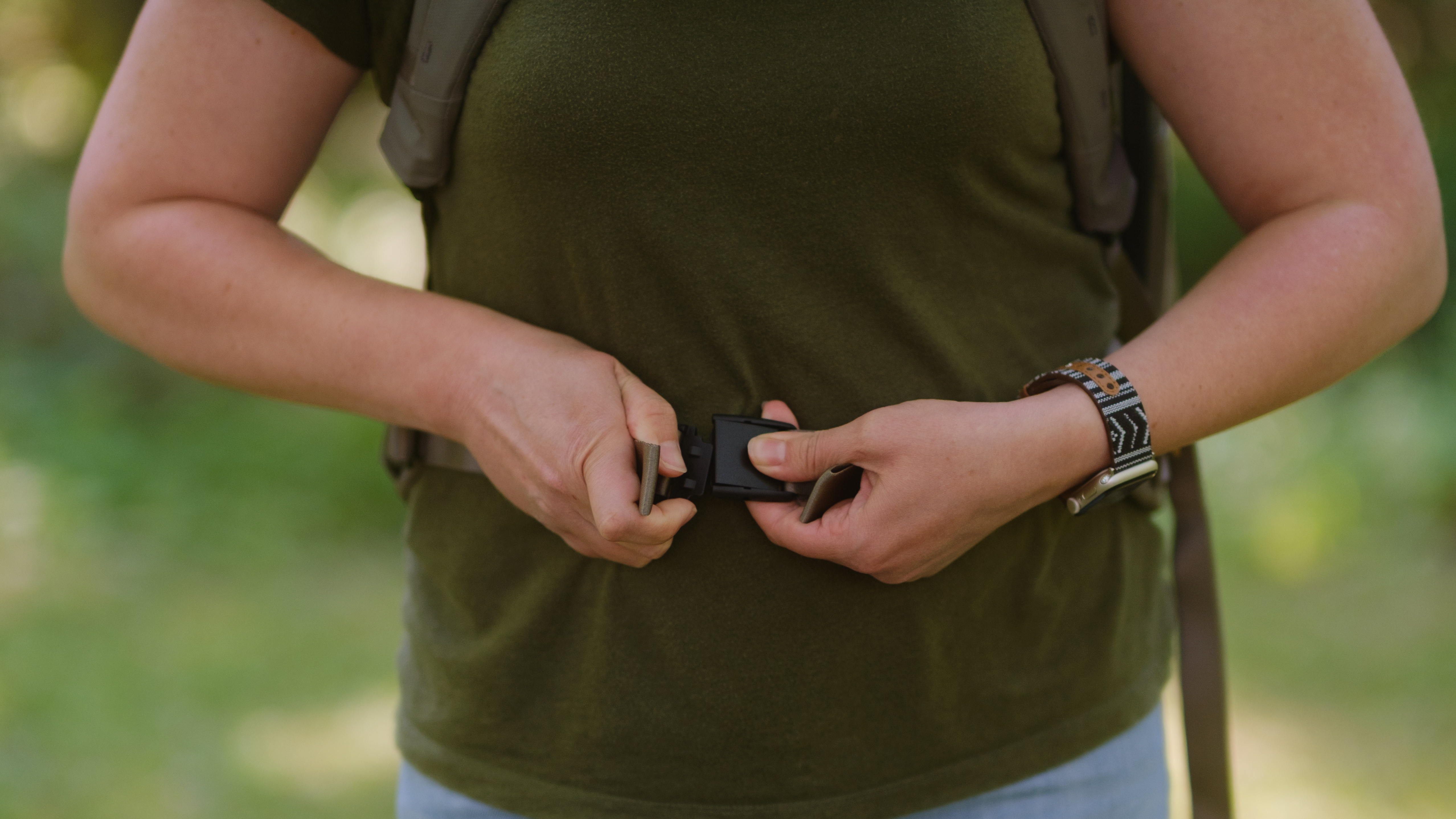 The Peak Design Travel 2-in-1 Backpack outdoors used by a photographer