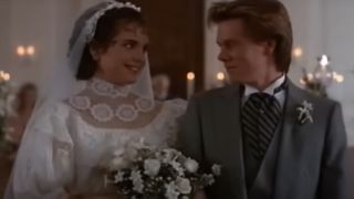 Elizabeth McGovern in a wedding dress walking down the aisle with Kevin Bacon in a morning suit.