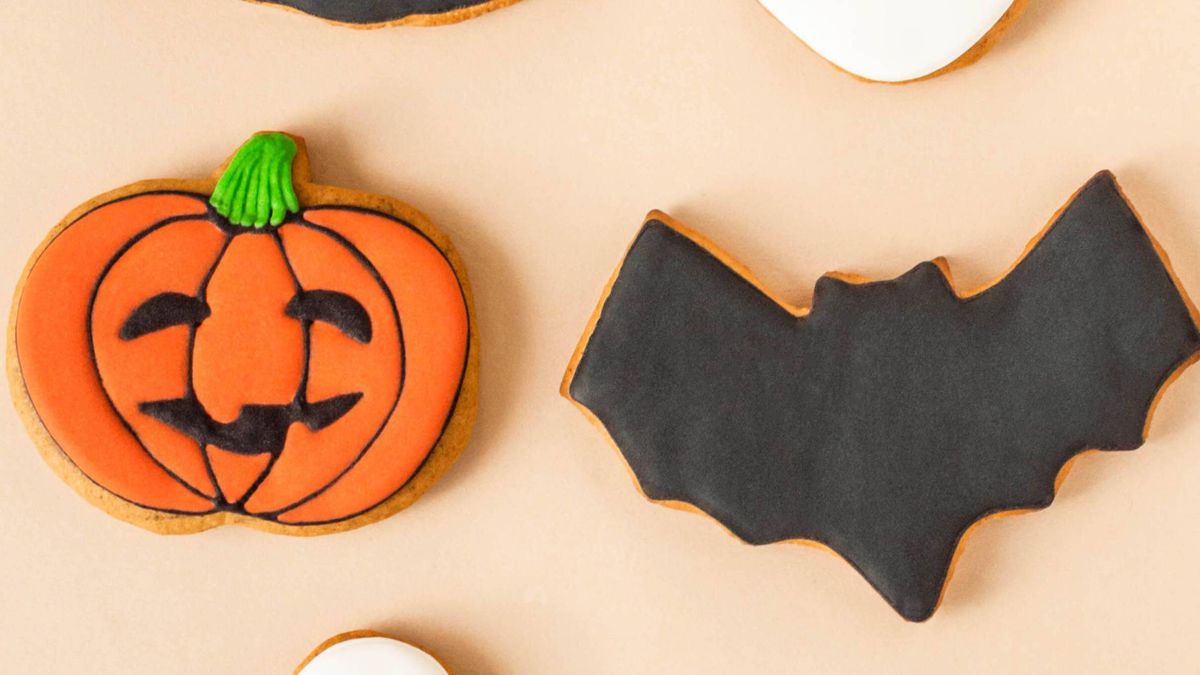Show off your decorating skills with these bat and pumpkin Halloween cookies