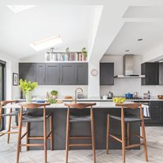 Light-filled kitchen extension with rooflights, grey units, and island seating 