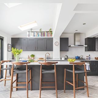 Light-filled kitchen extension with rooflights, grey units, and island seating