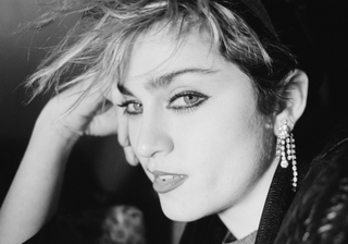 1980s Fashion: Madonna close up image wearing a leather jacket and a strong eyeliner look