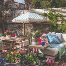 A garden with a designated dining area and a lounging zone