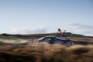 McLaren e-bike frame on roof of moving car