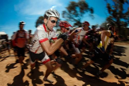 Ready, set, go: Riders make a dash for their bikes at the start.