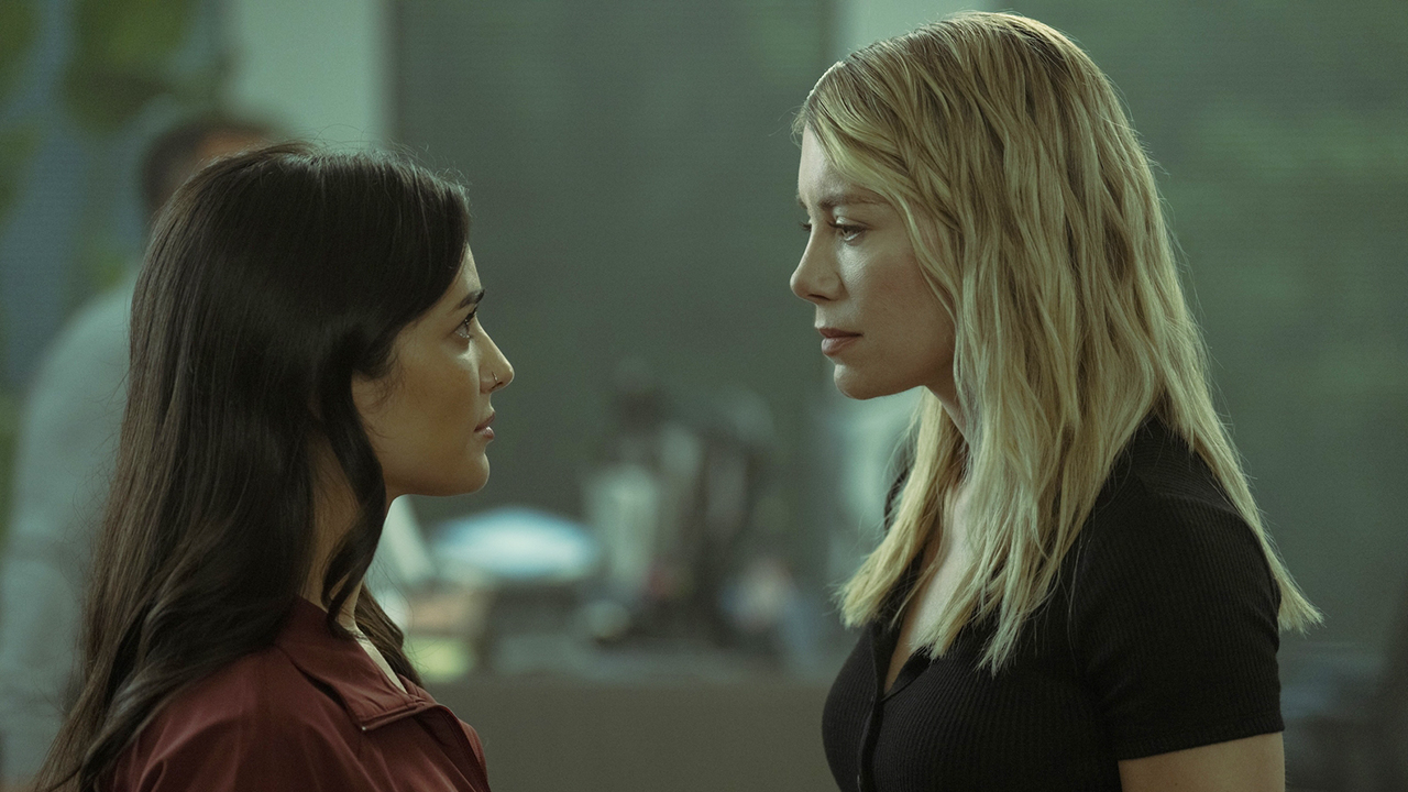 Sasha Bordeaux and Emilia Harcourt staring at each other in Peacemaker season 2 episode 5