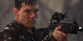 Tom Cruise with a gun in Jack Reacher