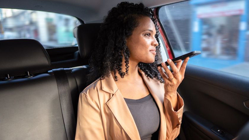 woman recording voice note on her phone