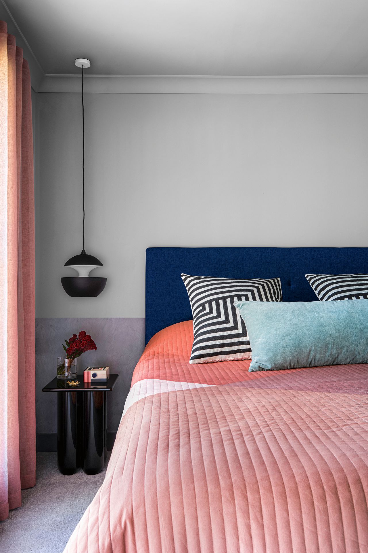 a modern bedroom with two tone walls