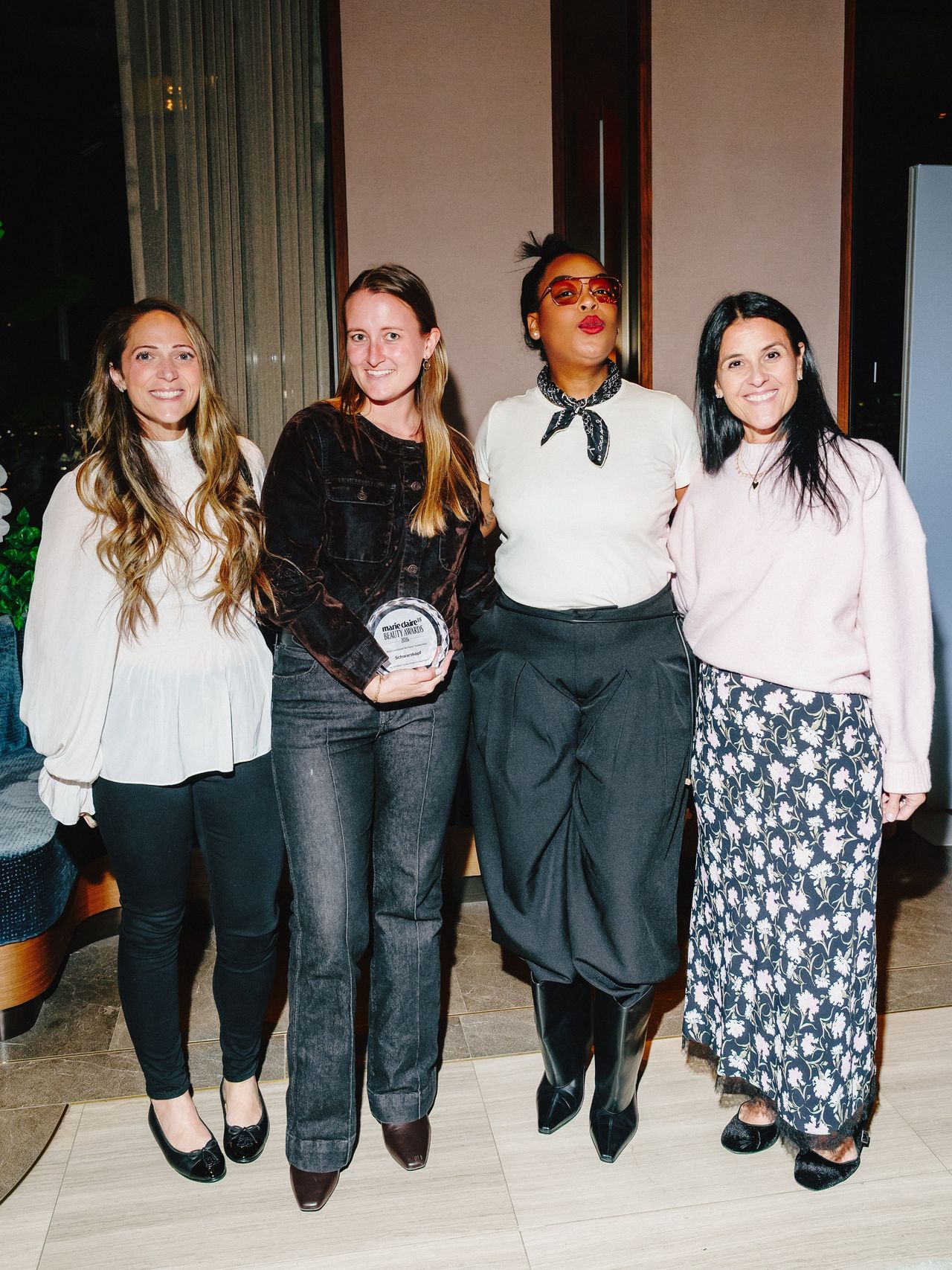four people at a party in NYC