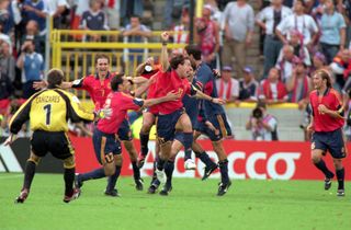Spain players celebrate their last-gasp 4-3 win over Yugoslavia at Euro 2000.