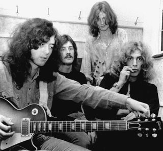 (from left) Jimmy Page, John Bonham, John Paul Jones and Robert Plant sit backstage at the Lyceum Theatre on October 12, 1969 in London