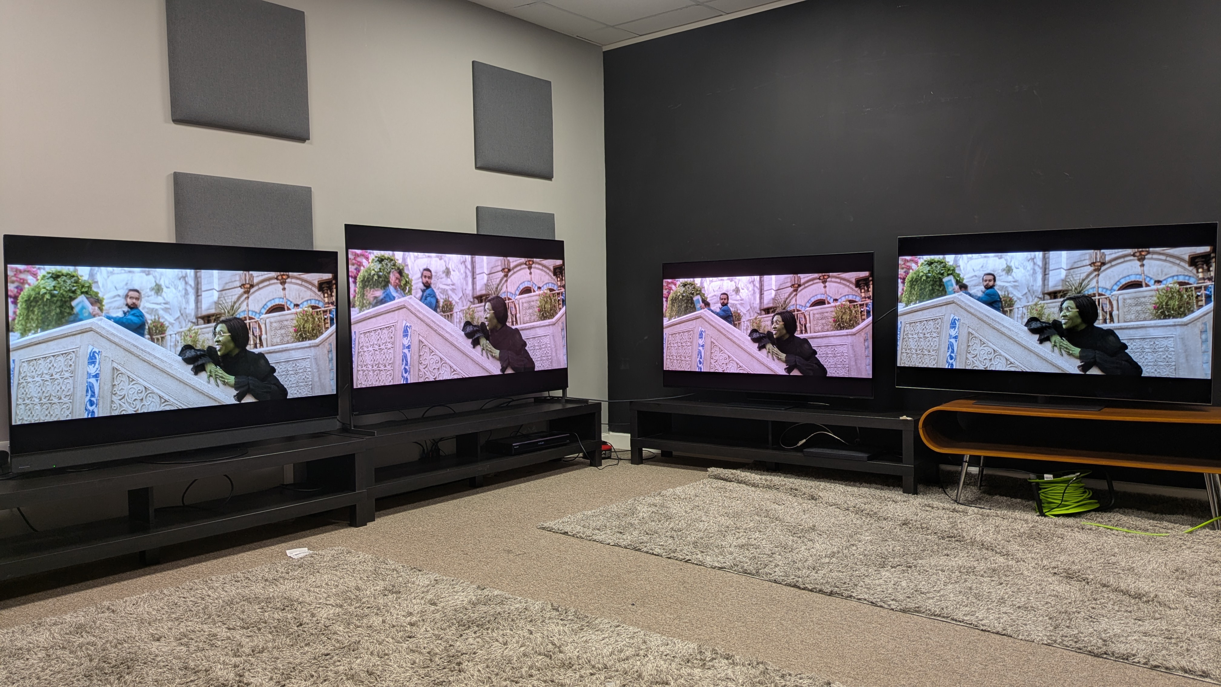 Panasonic Z95B (far left) Sony Bravia 8 II (middle left) Samsung S95F (middle right) LG G5 (far right) with Elphaba on screen from Wicked