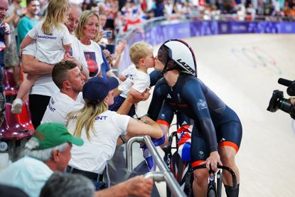 Team GB track rider celebrating with their family