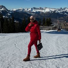 Marilyn NK on a mountain wearing a pair of the best snow boots