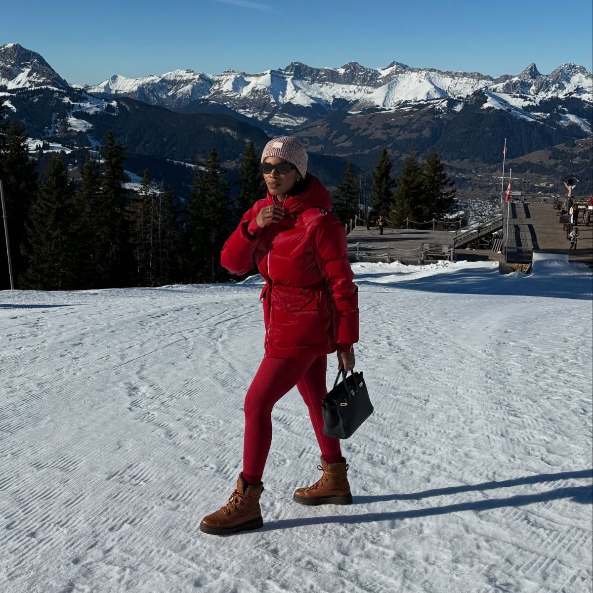 Marilyn NK on a mountain wearing a pair of the best snow boots