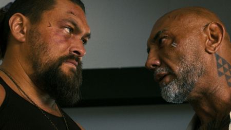 Jason Momoa and Dave Bautista stare at each other
