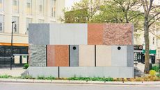 exterior patchwork effect of public toilet in Maida Vale by Studio Weave, seen by a tree