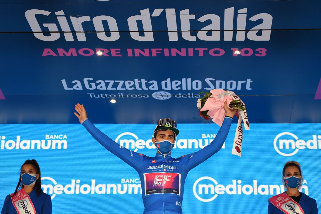 TORTORETO ITALY OCTOBER 13 Podium Ruben Guerreiro of Portugal and Team EF Pro Cycling Blue Mountain Jersey Celebration Flowers Miss Hostess during the 103rd Giro dItalia 2020 Stage 10 a 177km stage from Lanciano to Tortoreto girodiitalia Giro on October 13 2020 in Tortoreto Italy Photo by Tim de WaeleGetty Images