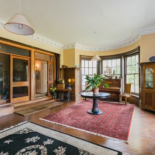 room with wooden flooring and ornate coving