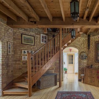 smock tower mill hallway with wooden floor and stair case