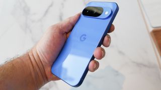 Google Pixel 10 in hand from 3/4 angle 