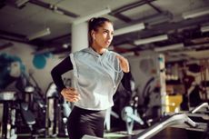 A woman running on a treadmill