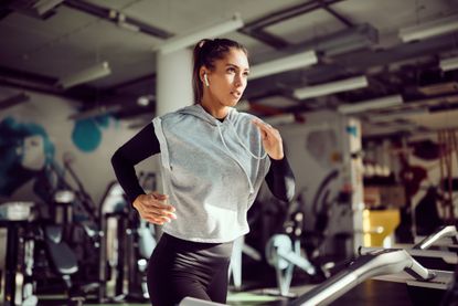 A woman running on a treadmill