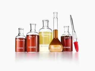 oumere skincare serums in test tube-like bottle against white background