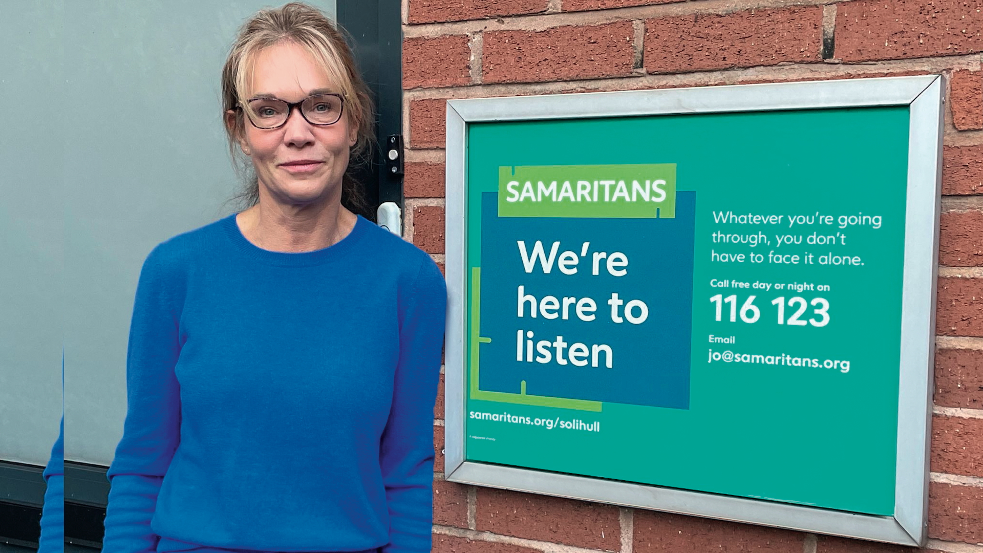 Helen Molyneux standing outside a branch of the Samaritans charity she volunteers at