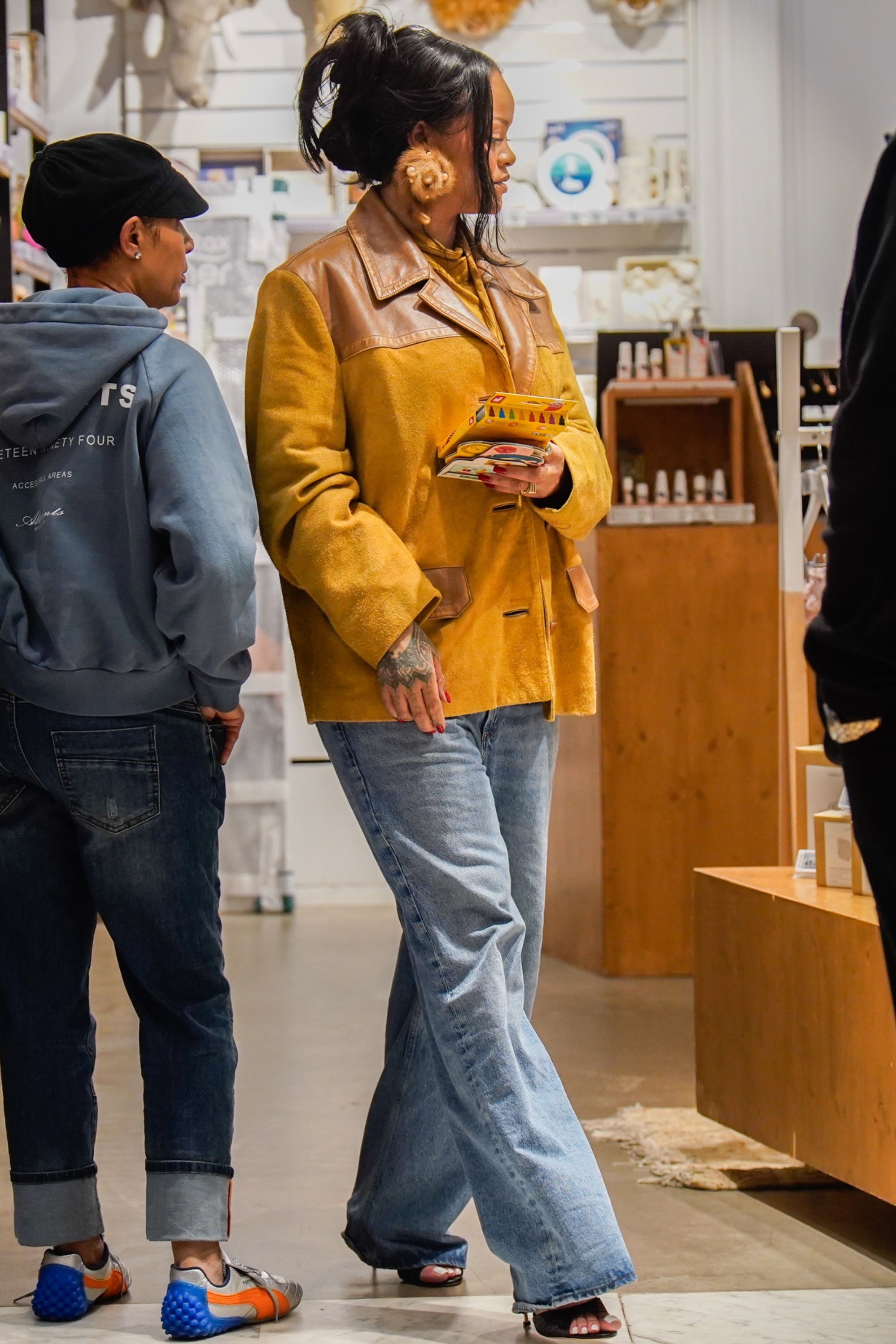 Rihanna was spotted in Paris wearing baggy straight-leg jeans with heeled sandals