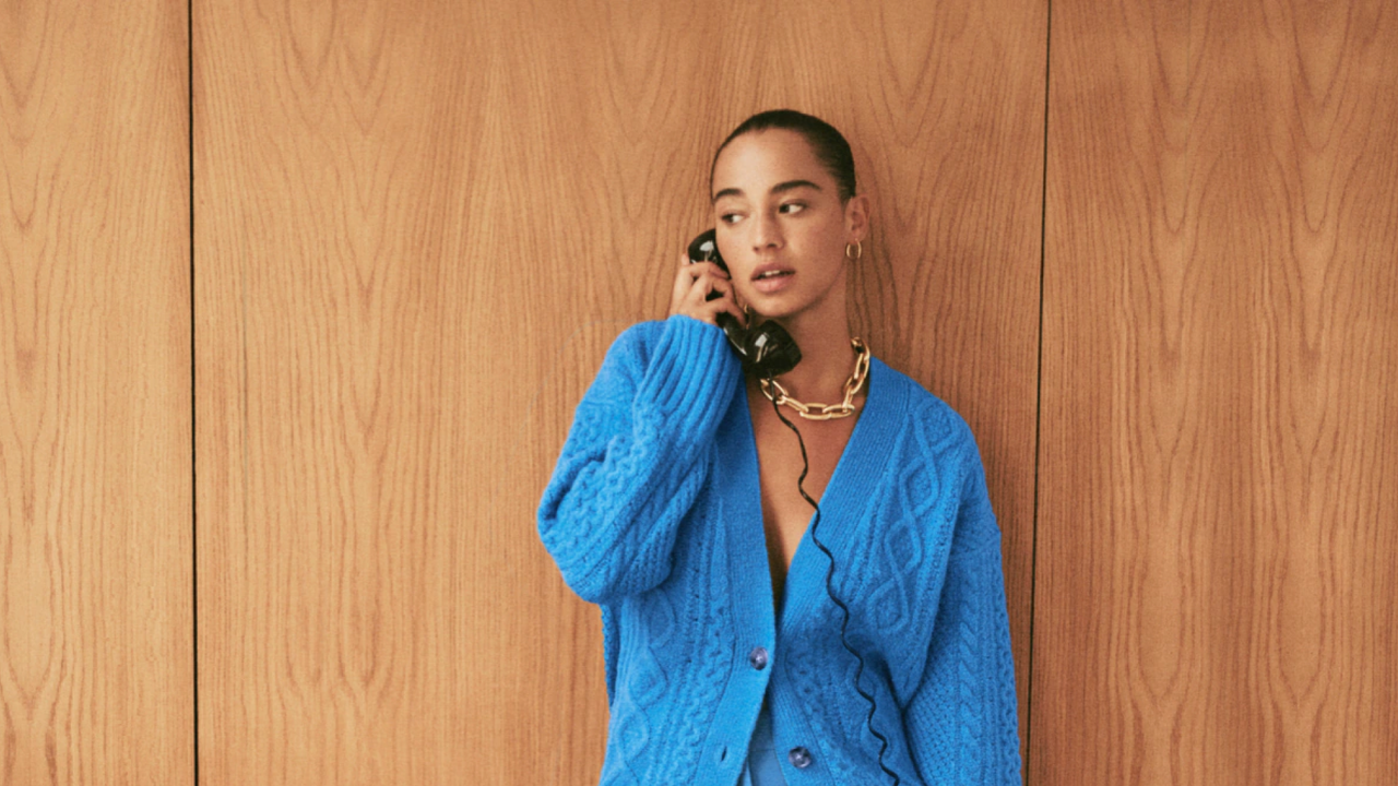 woman dressed in blue, on the phone