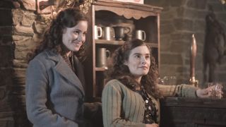 Imogen Clawson in a grey coat as Jenny and Rachel Shenton in a green cardigan as Helen in All Creatures Great and Small.