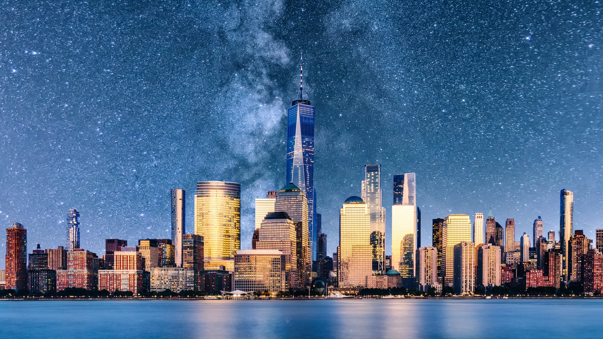 A view of NYC with a composite of a super starry sky behind.