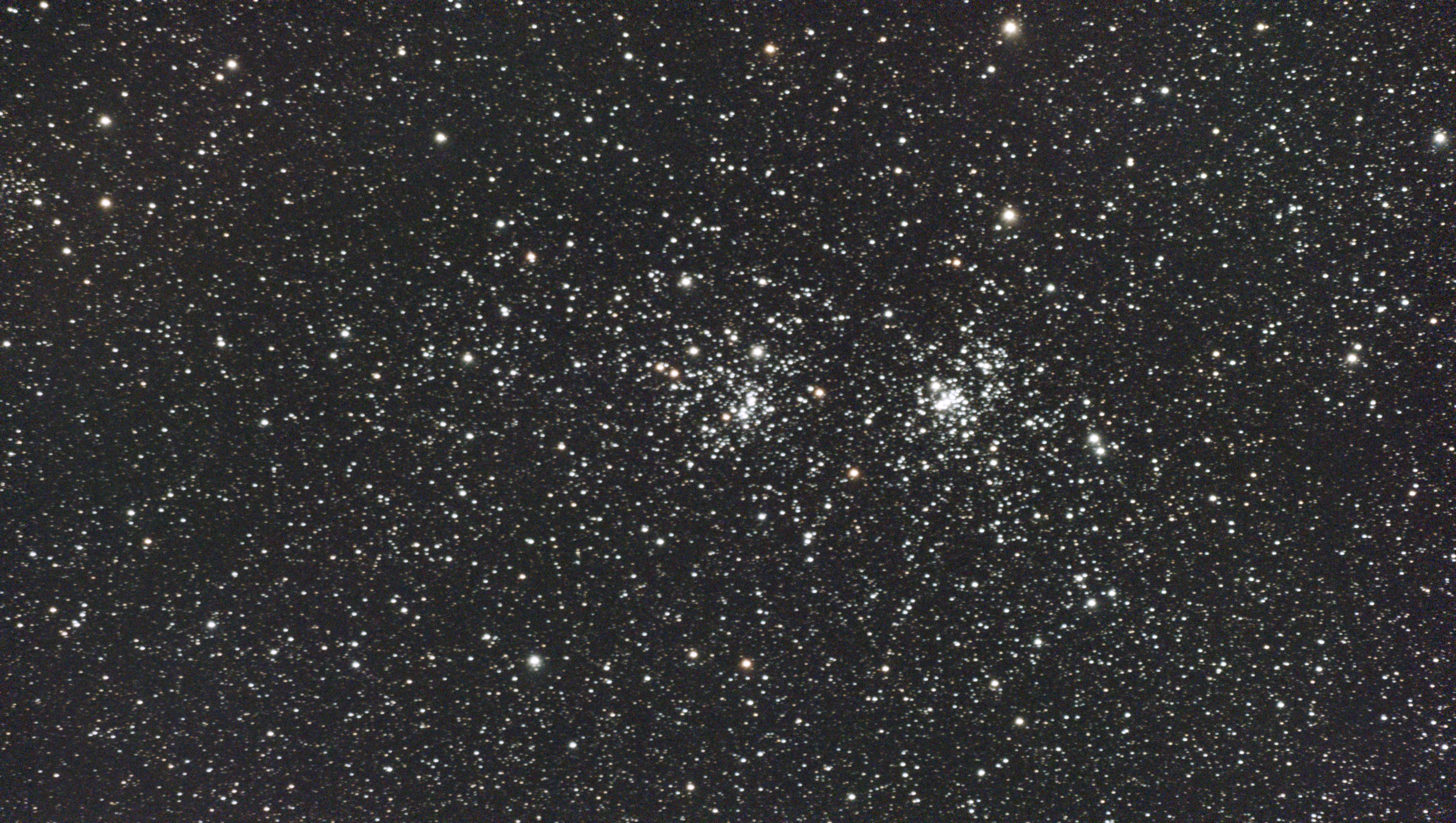 A photograph of the Double Cluster taken with the Dwarf III smart telescope, unprocessed
