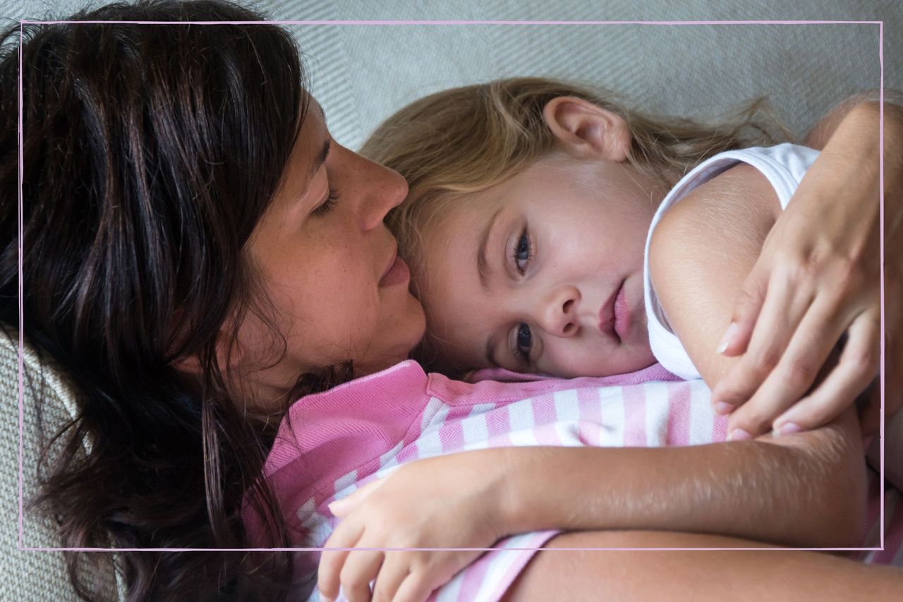 mother holding daughter who looks anxious