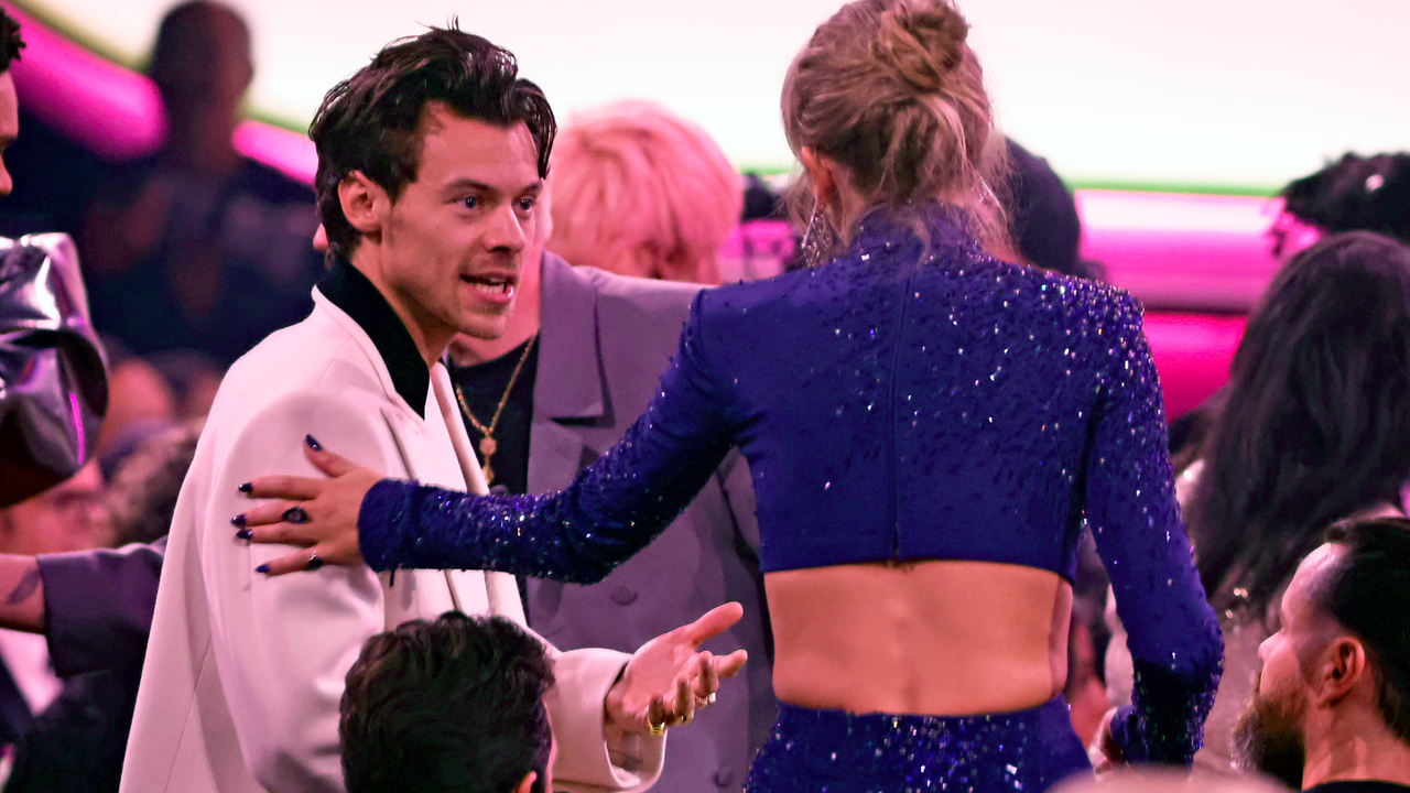 Harry Styles and Taylor Swift speak during the 65th GRAMMY Awards at Crypto.com Arena on February 05, 2023 in Los Angeles, California.