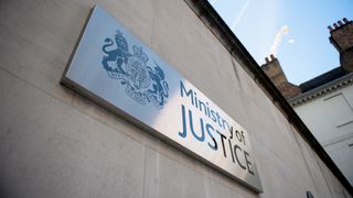 A close up shot of the Ministry of Justice sign outside its headquarters in London